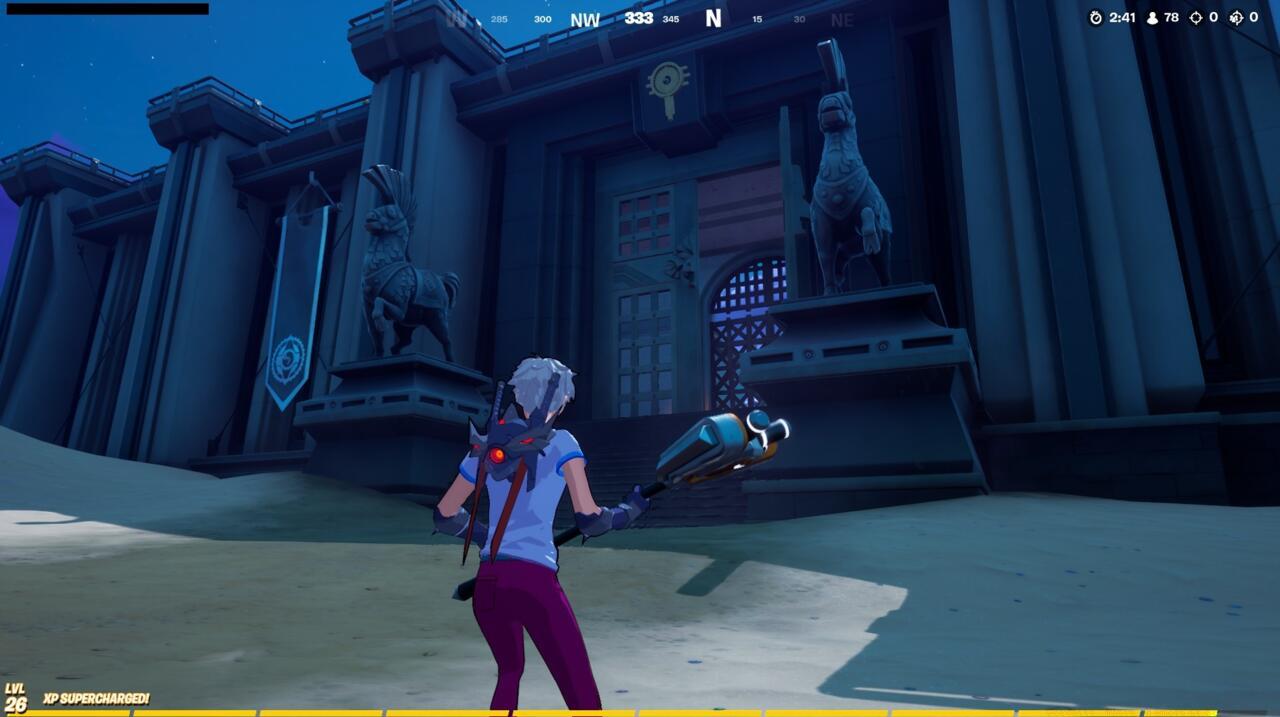 Stone statues near Colossal Coliseum in Fortnite.