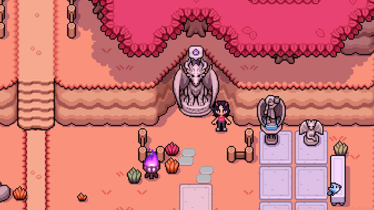 A Fields of Mistria farmer stands next to a statue of a dragon during the fall.