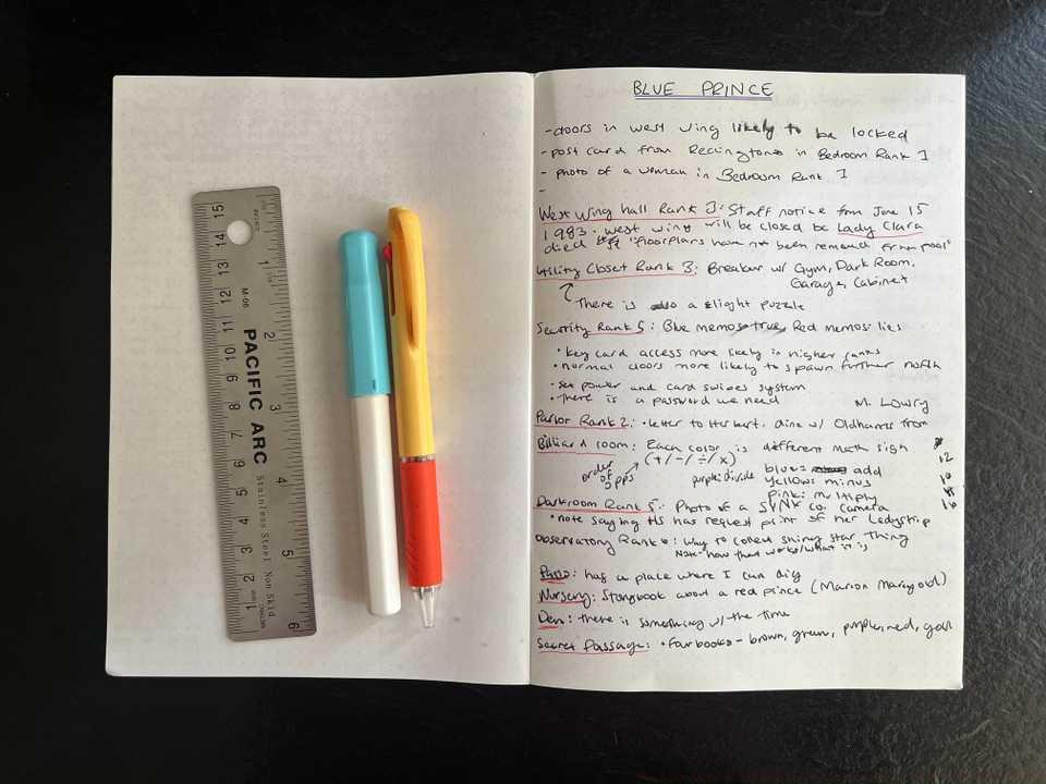 A photo of pens and a notebook that has notes from Blue Prince. Some parts are underlined in red ink and others in blue.