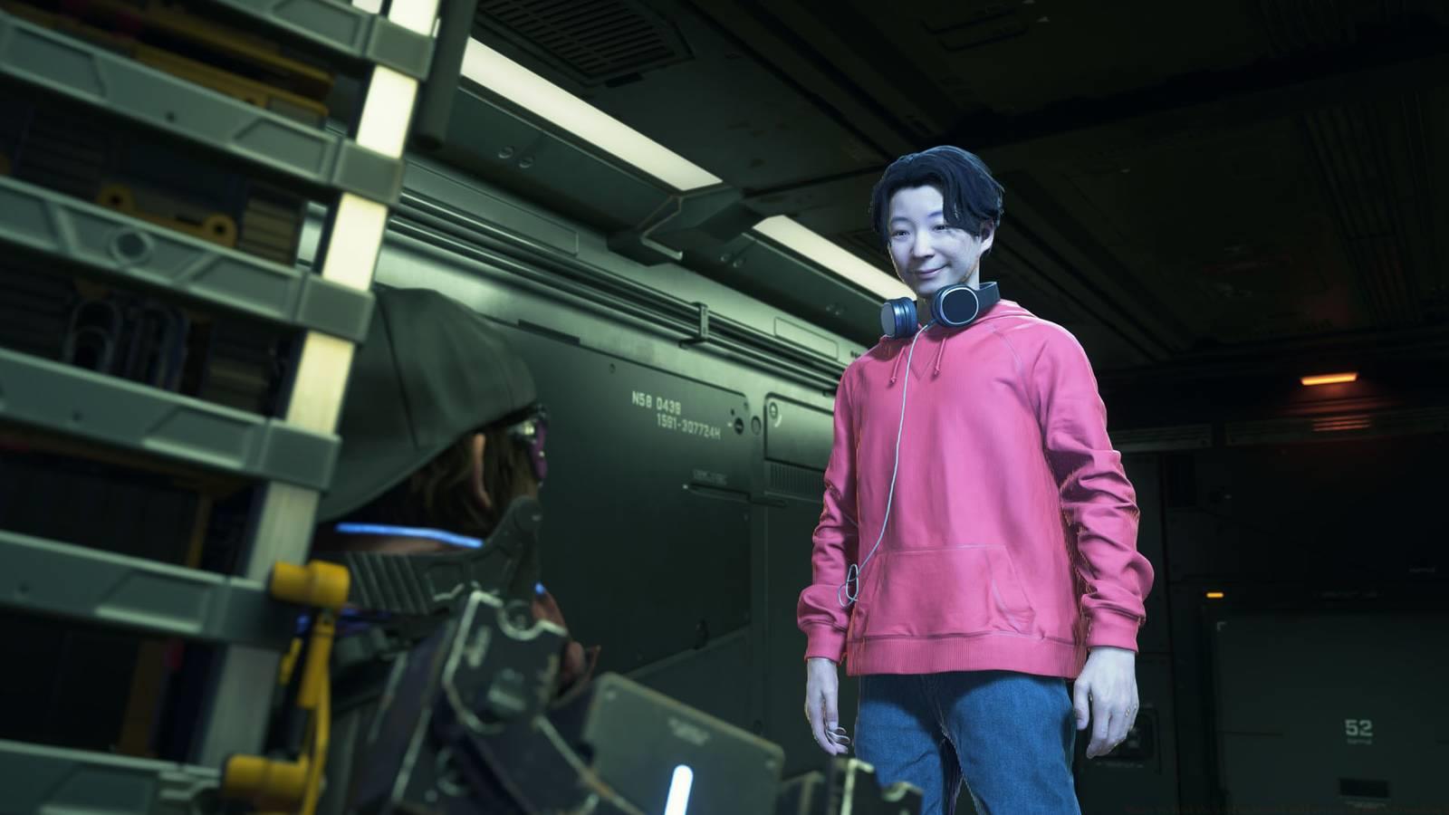 A Death Stranding 2 screenshot showing the hologram of a character with a pink blouse and headphones