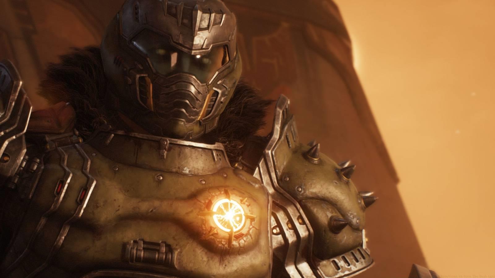 Doom Slayer from Doom: The Dark Ages facing the screen in a arid yellow-ish scenario